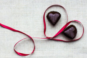 Valentines Day Background - Red Ribbon And Chocolate In The Shap